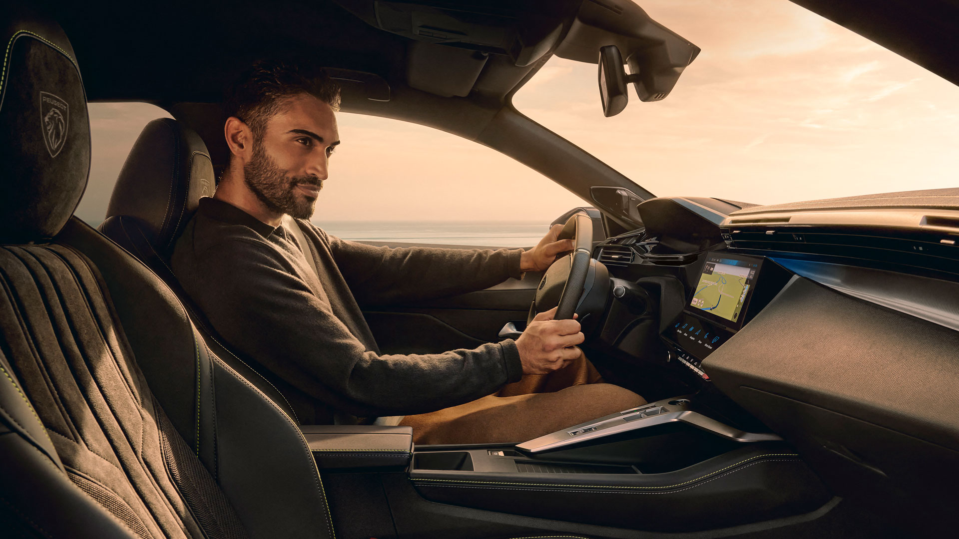 Man driving the new PEUGEOT E-408