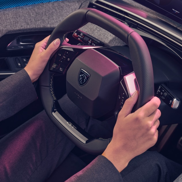 Hands on the steering wheel of the new PEUGEOT 3008 hybrid